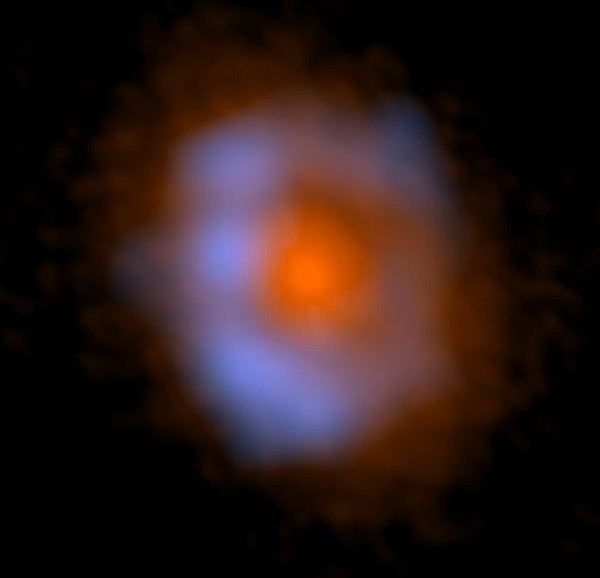 False-color image of V883 Ori taken with ALMA. The distribution of dust is shown in orange and the distribution of methanol, an organic molecule, is shown in blue . Credit: ALMA (ESO/NAOJ/NRAO), Lee et al.